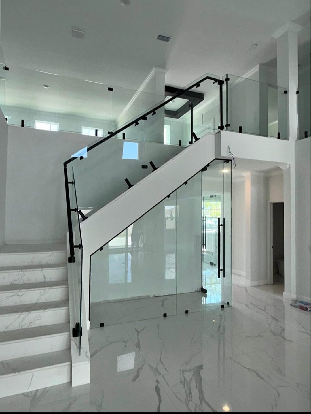 Interior staircase glass railings by Racso Glass LLC