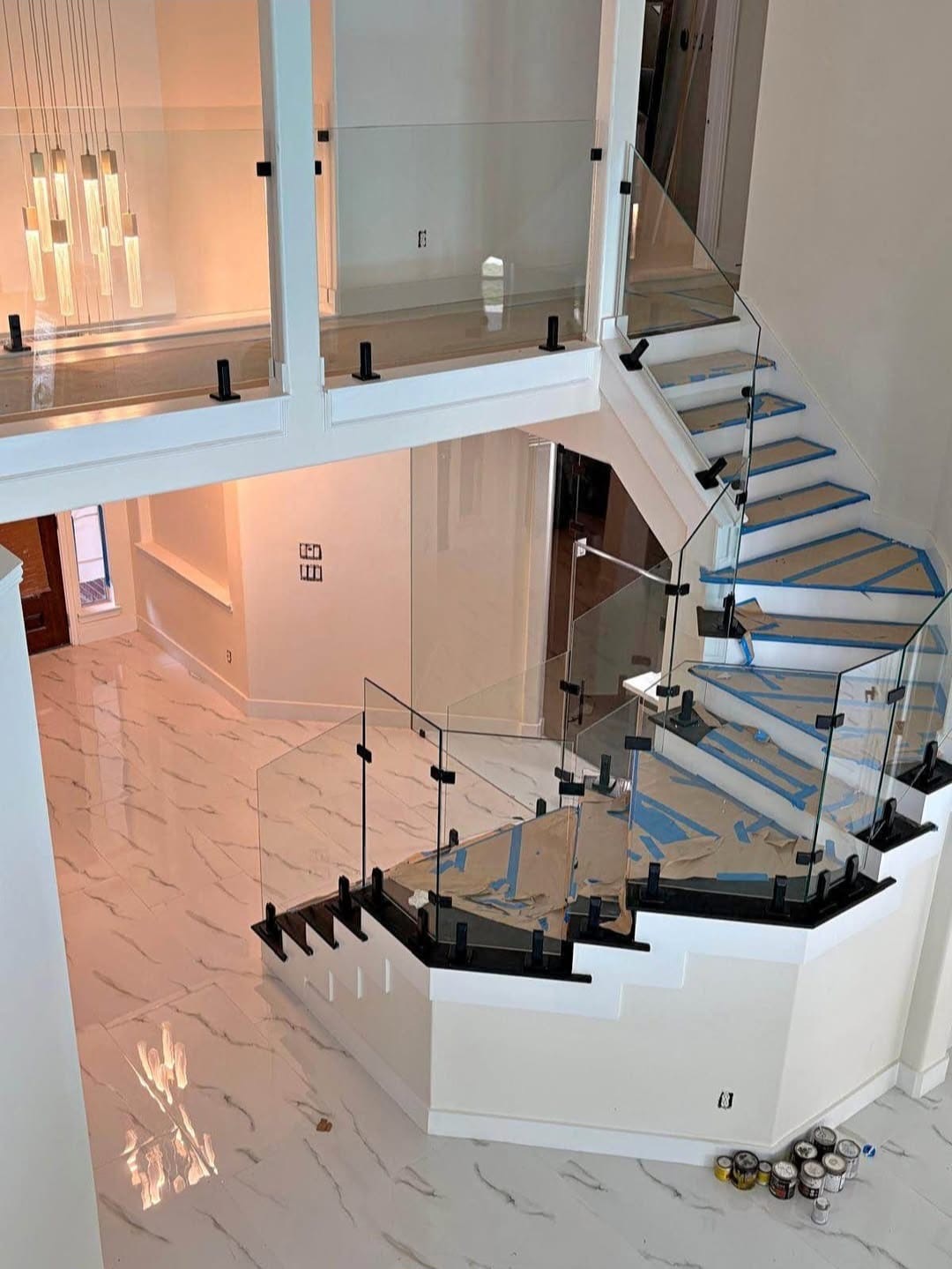 Custom stair and landing glass railings by Racso Glass LLC